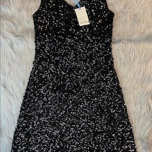 Amber Blue Sequins black dress above the knees.